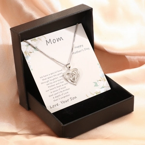 Silver heart necklace with mother and child silhouette in premium black gift box set