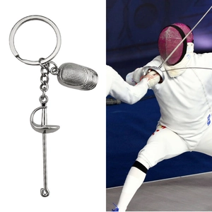 Fencing sport metal keychain with silver fencing mask and sword charms on a white background