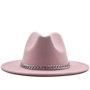 Detailed close-up of pink wide brim felt fedora hat with silver chain band decor