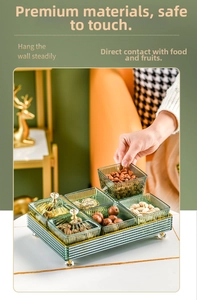 Close-up of green ribbed glass divided trays with crystal knobs for nuts and dried fruits