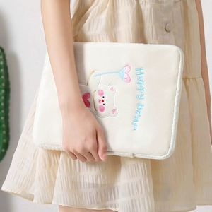 Detail of cute bear embroidery and Happy Bear text on soft plush tablet sleeve case