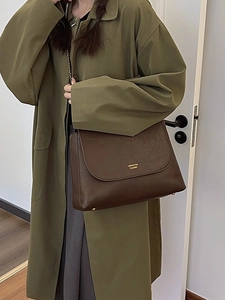 Classic dark brown leather chain bag with gold lettering and shoulder strap for women