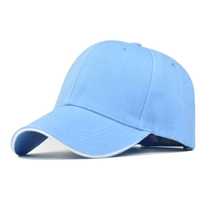 Detail of light blue baseball cap featuring a white contrast edge on the curved brim