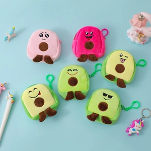 Close-up of cute plush avocado coin purses with colorful hooks in various expressions