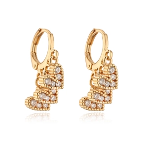 Detail shot of 18K gold plated heart earrings with sparkling cubic zirconia inlays