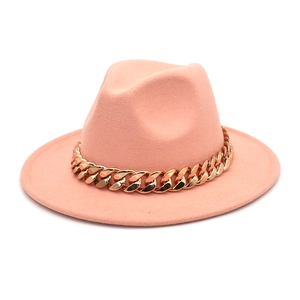 Detailed view of pink wool fedora hat with a bold gold chunky chain decoration