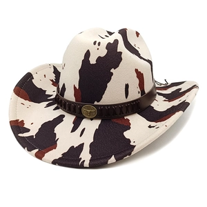 Western cowboy hat with cow print pattern and leather band featuring a bull emblem