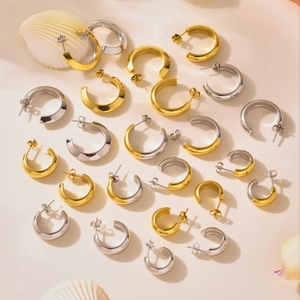 Minimalist high-polish C-shaped hoop earrings set in gold and silver stainless steel
