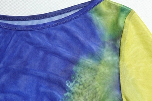 Close-up of vibrant gradient mesh fabric and neckline detail on a crop top
