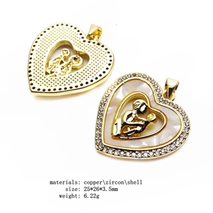 Macro shot of gold MOM heart pendant with inlaid zircon and natural shell textures
