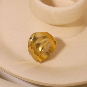 Minimalist gold stainless steel wide ring with wavy texture and adjustable open design
