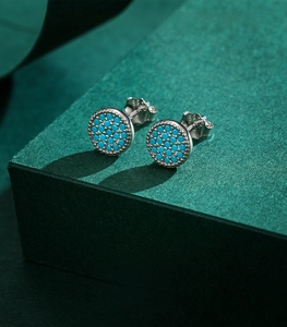 Detail showing S925 hallmark on silver stud earrings with turquoise blue micro-inlays