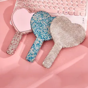 Sparkling rhinestone heart-shaped handheld makeup mirrors in pink, blue, and silver