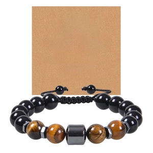 Detailed view of 10mm tiger eye and obsidian bead bracelet with inspirational card