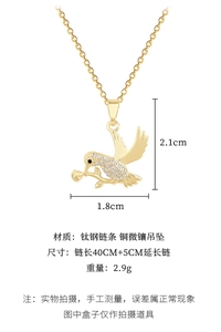 Detailed macro of hummingbird pendant necklace with crystals and titanium steel chain