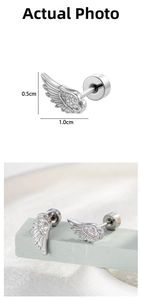 Detailed close-up of silver angel wing cartilage studs with zircon and screw back sizing