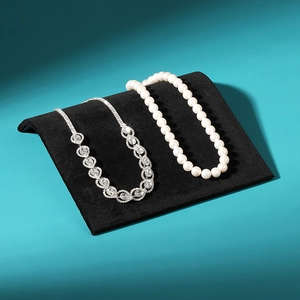 Creative S-shaped black velvet jewelry display stand with pearl and rhinestone necklaces