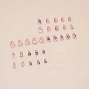Short almond press-on nails with blue and pink floral patterns on nude base set