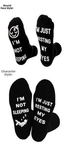 Detail showing non-slip printed soles with I'M NOT SLEEPING text on black cotton socks