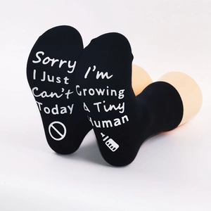 Detail of black maternity socks with white non-slip Sorry I Just Can't Today text