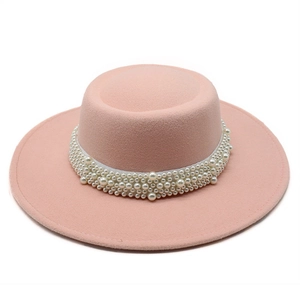 Detail of light pink wool felt boater hat with a decorative wide white pearl band