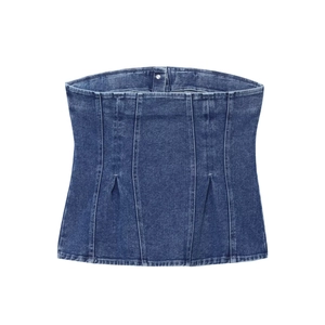 Detailed flat lay of a blue washed denim tube top showing stitching and fabric texture