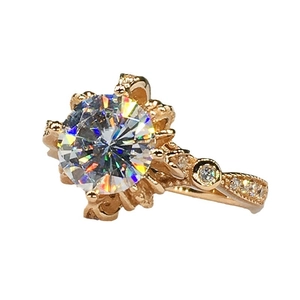 Rose gold flower ring with circular cubic zirconia center and hollow vintage pattern