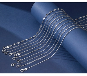 Detailed macro view showing diverse types of 925 sterling silver chain styles and patterns
