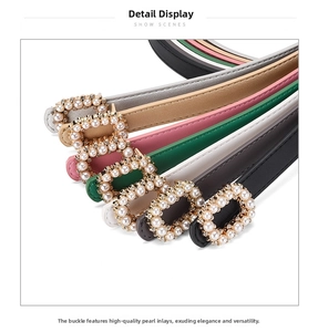 Detailed view of pearl and rhinestone inlaid rectangular metal buckles on colorful belts