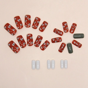 Vintage red and olive floral press-on nails set with glossy finish and heart patterns