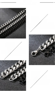Detail of stainless steel curb chain showing polished silver and black finish with lobster clasp
