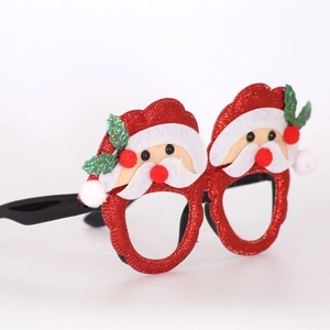 Detail of 2026 Christmas glasses with red glitter Santa Claus frames for photo props