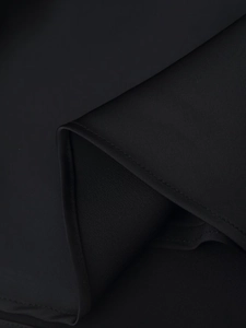 Detailed macro view of the black lace satin camisole hem stitching and fabric texture