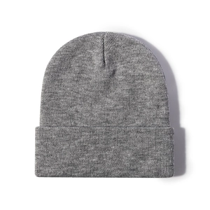 Thick grey knitted beanie hat with wide fold-up cuff for winter warmth and outdoor style