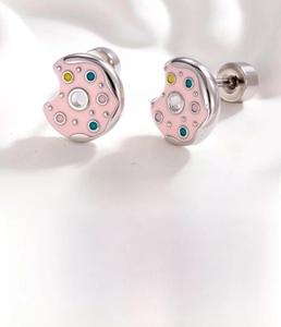 Detailed view of pink enamel donut cartilage stud earrings with titanium steel screw back