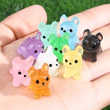 Palm size comparison of colorful mini resin bulldog figurines for DIY crafts