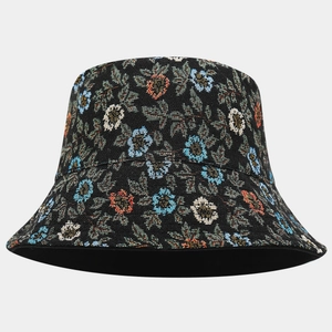 Close-up of vintage floral jacquard pattern and woven texture on a black bucket hat