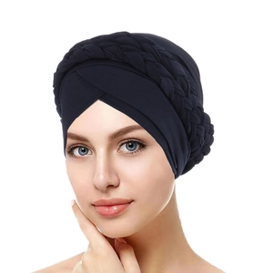 Detail of navy blue turban hat featuring a braided design and soft milk silk fabric texture