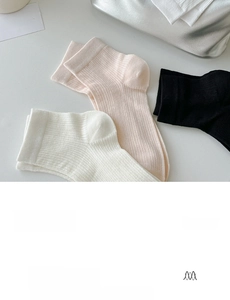 Detail showing high-quality combed cotton texture and ribbed knit on ankle socks