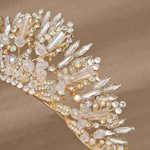 Luxury bridal tiara in gold metal finish featuring sparkling crystals and rhinestones