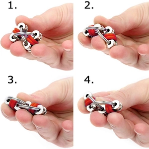 Fidget toy bike chain keychain with red and blue rubber rings on white background