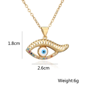 Macro view of gold-plated evil eye pendant necklace showing dimensions 1.8x2.6cm