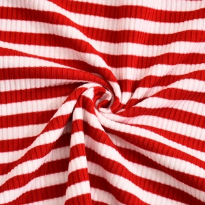 Macro shot of red and white striped ribbed knit fabric showing soft texture and elasticity