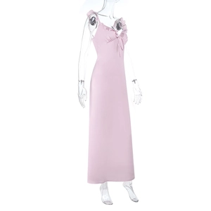 Detail of pink satin maxi dress with ruffled V-neckline and front bow tie design