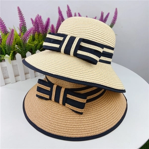 Summer sun straw hats in beige and brown with chic striped bows and black brim piping