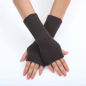 Close-up of dark brown ribbed knit fingerless gloves and arm warmers for women