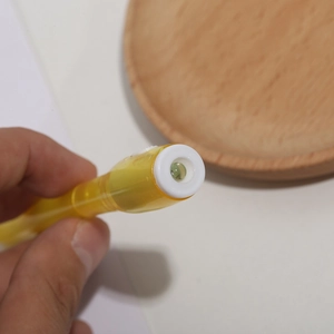 Multifunctional UV magic pen with built-in LED light and yellow translucent plastic body