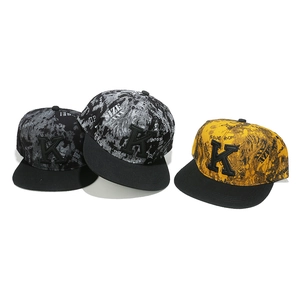 Detailed close-up of hip-hop snapback hats with K-letter embroidery and graffiti texture
