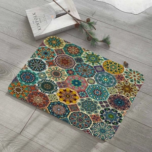 Detail of bohemian mandala floral print on a waterproof flannel laptop sleeve mat