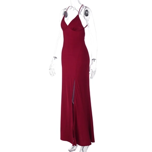 Detail view of the high side slit and deep V-neckline on this sexy burgundy slip dress